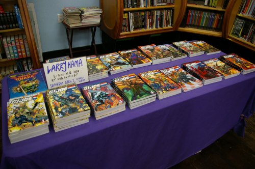 Larry Hama signing at Hub Comics G.I. Joe books graphic novels on table